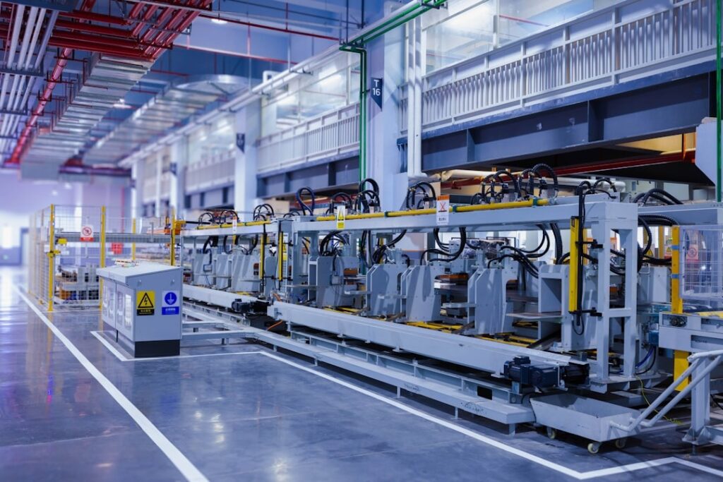Industrial operations floor with people reviewing system information